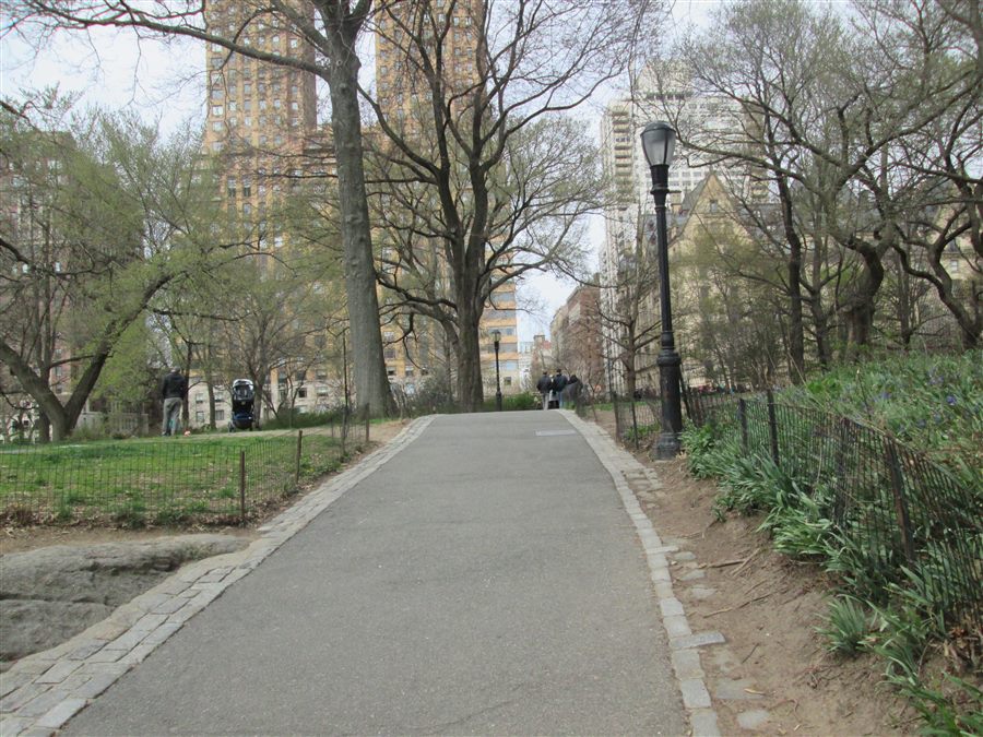 Walkers on a path near Strawberry Fields in Central Park